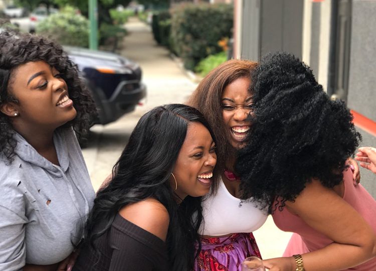 Five women laughing
