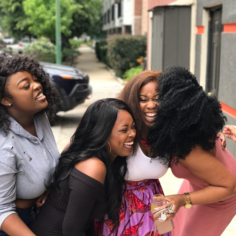 Five women laughing