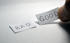 "Bad" and "Good" written on two pieces of paper