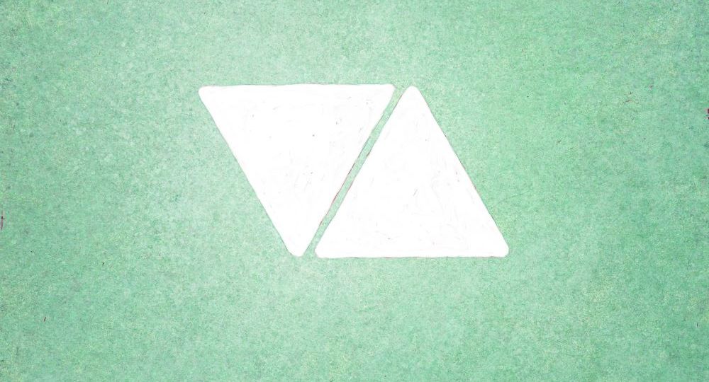 Two white triangles on pale green background