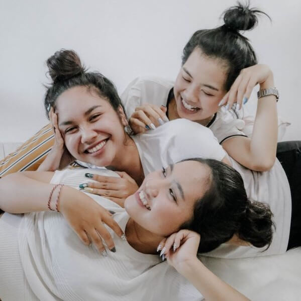 Three sisters laughing